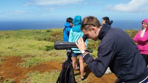 man using spotting scope