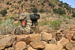 person using binoculars for shooting